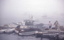 Islesboro town dock with dinghies in Fog