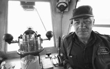 Ferry crewman in pilot house