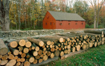 Thompson red barn with wood pile